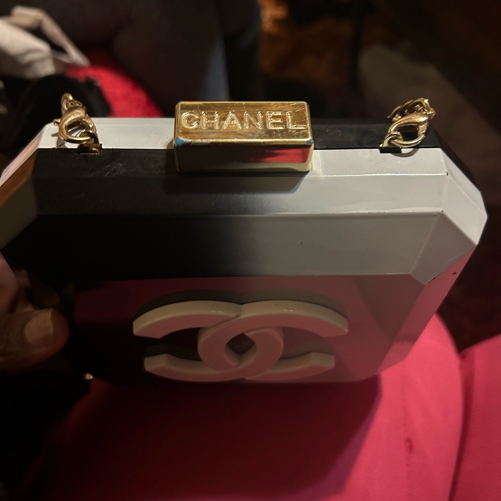 CHANEL Black and White Clutch with Gold Accents